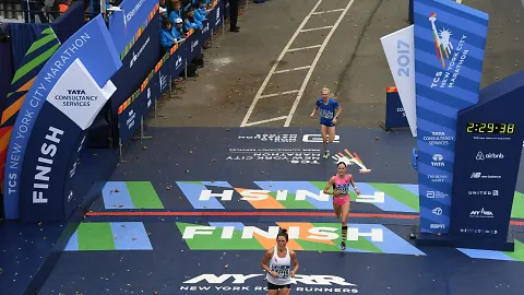 Runners finish the NYC Marathon.